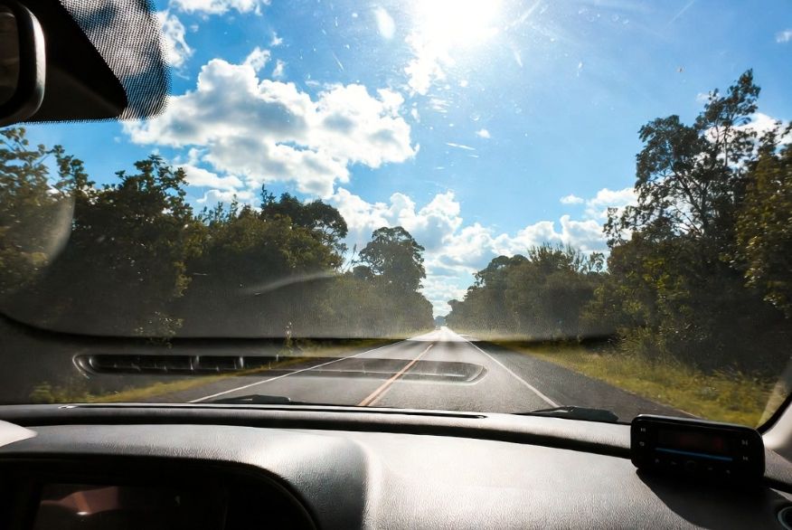 road trip scene through a crystal-clear windshield